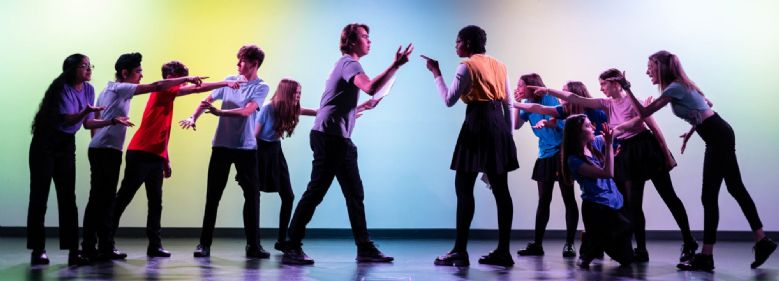 Image of students performing on stage