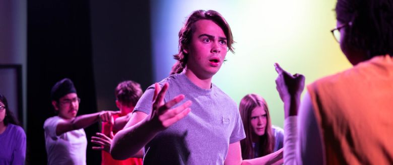 Image of students performing on stage