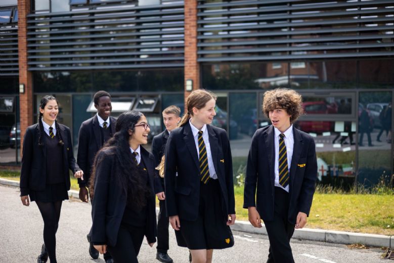 Image of students walking in a group